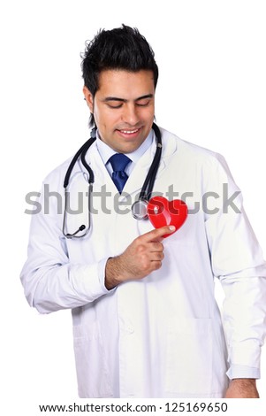 Male doctor with stethoscope holding heart, isolated on white background