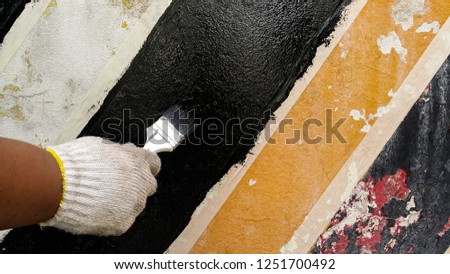 Footpath black and yellow color with brick wall background with free space  : Traffic signs background and texture concept