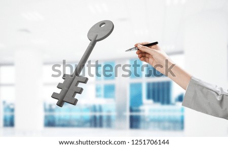 Cropped image of businessman in suit and stone key symbol. Mixed media