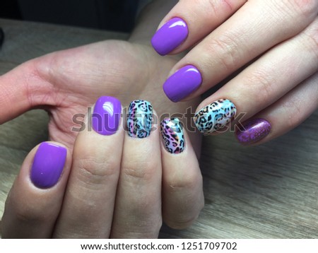 fashion manicure lilac and blue color and leopard design