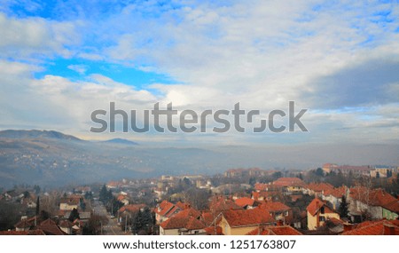 panorama of mountain village with dramatic sky