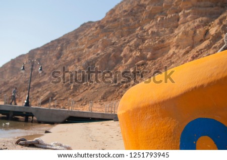 Beautiful view to the mountains on vacation. Nice and colorful picture. An orange buoy close-up. Sunny weather outdoors. 