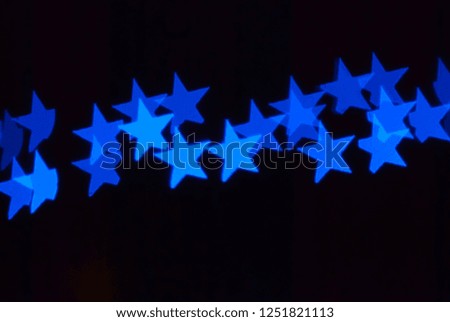Bokeh Effect of Stars in Blue with Black Background