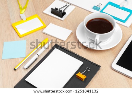 Corporate identity design template on wooden desk close up