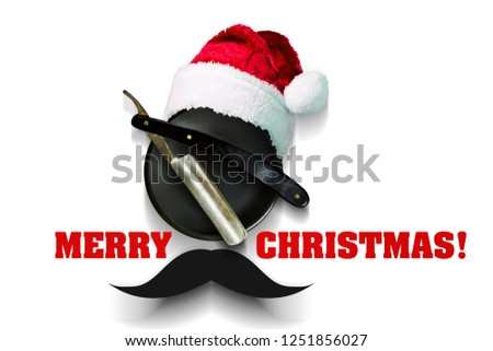 Razor on a plate for foam with a Santa Claus hat on a white background. Inscription Merry Christmas. Greeting card Happy New Year and Merry Christmas for a hairdresser and barber shop. Isolated