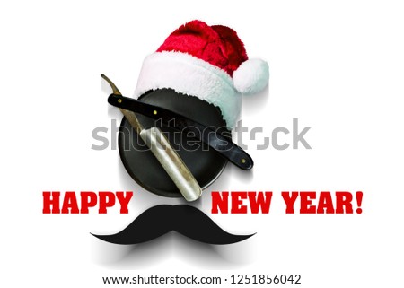 Razor on a plate for foam with a Santa Claus hat on a white background. Inscription Happy New Year. Greeting card Happy New Year and Merry Christmas for a hairdresser and barber shop. Isolated