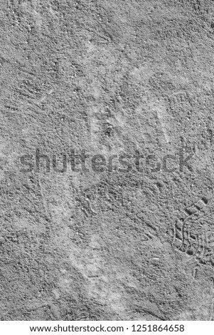 Photo of a ground sand texture in black and white for background.
