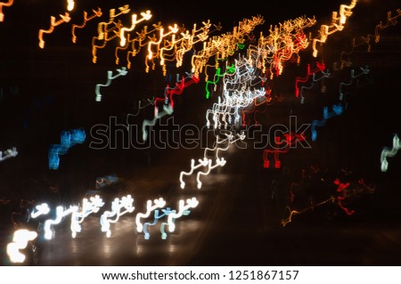 Blurred in motion lights of the city. Abstract background, bokeh