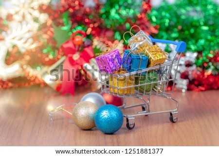 close up shopping cart with gift box, merry christmas, happy new