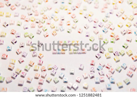 Conceptual of Happy New Year Words made with Colorful Alphabetical Beads
