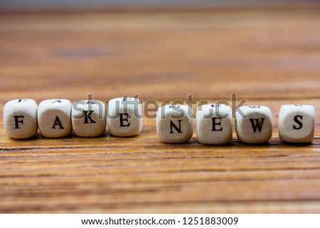 words fake news written in wooden letters