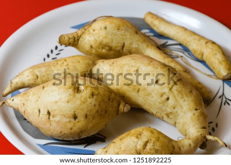 white sweet potato protein closeup in white cup organic natural vegetables food on isolated red background