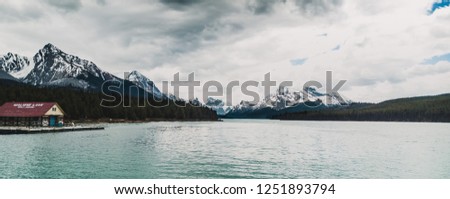 View of the Maligne lake and Mountain on a cold spring day, in Jasper National Park of Canada