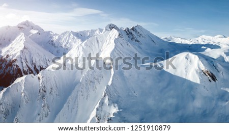 Grand view over steep slopes on a sunny winter day. Location place famous ski resort Silvretta Arena Ischgl/Samnaun on the Swiss Austrian border. State Tyrol, Europe. Discover the beauty of earth.