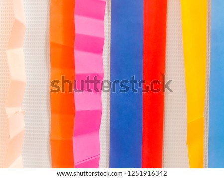 Colored paper strips decorate on board