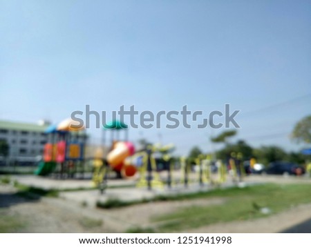 Blur the playground as an abstract background.