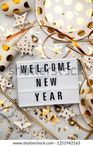 Welcome new year lightbox celebration message with luxury gold party decorations