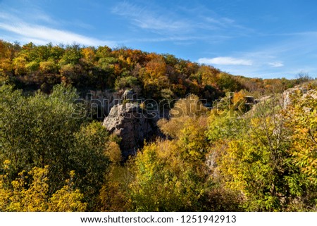 Nature In the Autumn of the Beech Canyon, Ukraine. Interesting places and travels in Ukraine. The Mountain Tikich River flows in Proterozoic granites, whose age is estimated at 2 billion years