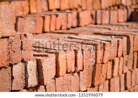 Piles of red bricks background.
