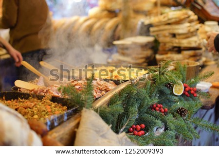 December 2018. Traditional Polish country bread with lard or garlic butter at a Christmas Market stall in Krakow, Poland. Traditional Polish street food in Cracow.     