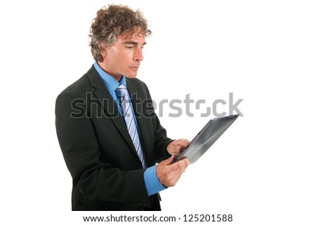 Business man with digital tablet standing in the studio isolated over white background