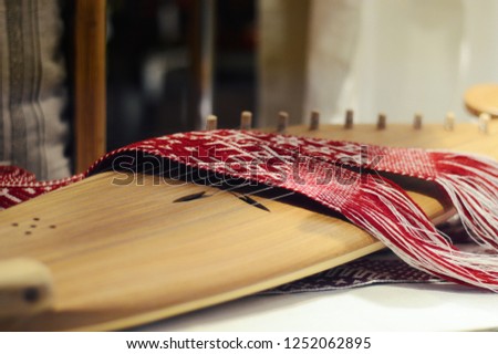 psaltery, Latvian kokles, zither, ancient traditional folk instrument with decoration Royalty-Free Stock Photo #1252062895
