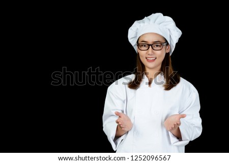 Portrait Asian women chef Third, wear white clothes. Standing up, arms and hands are inviting customers use the service in restaurants with excellent cooks from around the world. On black background