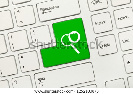 Close-up view on white conceptual keyboard - Green key with Secure Searching symbol