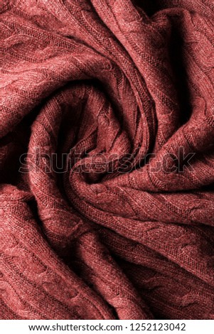 Trend photography on the theme of the new color of the year 2019 - Living Coral. Knitting wool texture background
