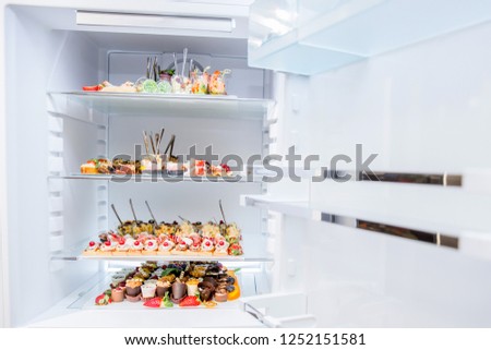 Open fridge full with food