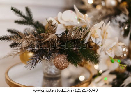 Merry Christmas and Happy New year Holidays! Decorating the Christmas tree indoors. Macro or close picture of xmas tree and gifts under it. Gift box background for 2019 new year gift card