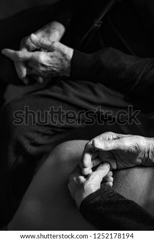 Hands of two old women