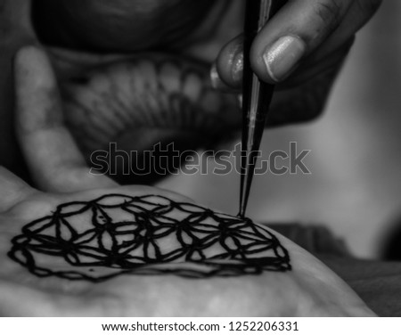 hands creating art and writings
