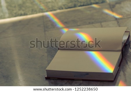 Rainbow book. Stack of books in the library and blur bookshelf background