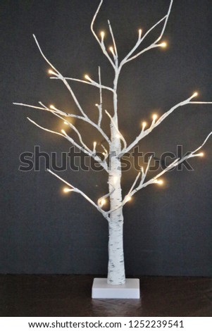 Christmas Tree with bare limbs and fairy lights
