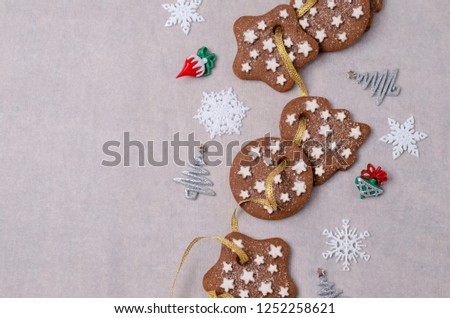 Traditional Christmas cookies with icing on paper. Selective focus.