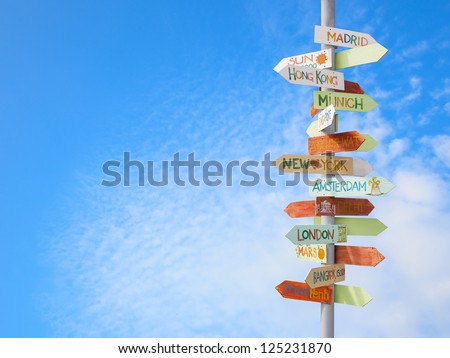 travel traffic sign and blue sky Royalty-Free Stock Photo #125231870