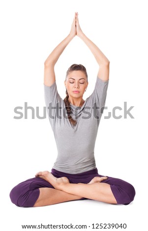 Young woman doing yoga exercise Padmasana (Lotus Pose). Isolated on white background