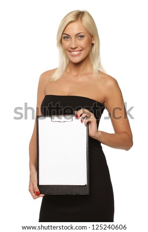 Smiling woman standing holding a white blank billboard / placard, over white background