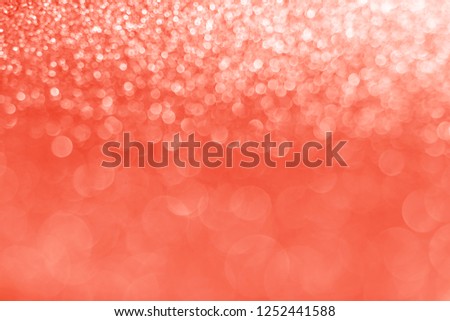 Delicate glitter bokeh Living Coral background. Creative and moody color of the picture. Color of the 2019 year.