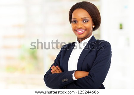 pretty african american businesswoman half length portrait in office