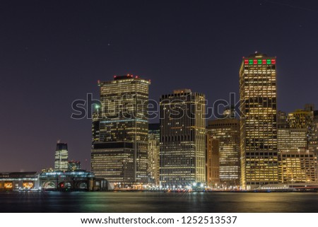 Manhattan skyline panorama with Times Square lights at dusk, New York City, USA
