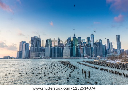 View of Manhattan at sunset from the side of the pier. NYC, USA