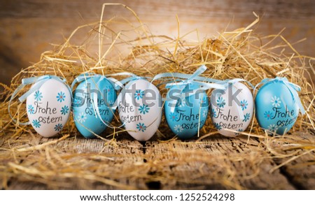 Easter decoration eggs cute bunny. Happy Easter. Vintage style toned picture Text in GErman HAPPY ESTER