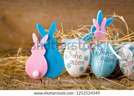 Easter decoration eggs cute bunny. Happy Easter. Vintage style toned picture Text in GErman HAPPY ESTER