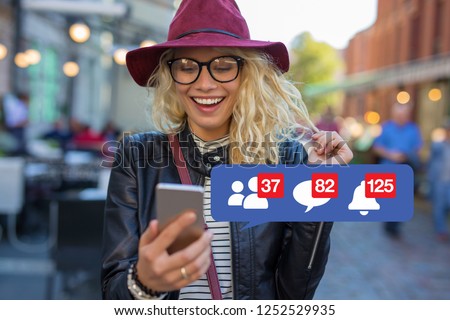 Woman excited about getting attention on social media Royalty-Free Stock Photo #1252529935