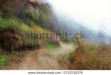 Tajo footbridges, Tribute to Monet, impressionist photograph of the road next to the Tagus River in Toledo, Spain, in Autumn with fog, photographic sweeps at low shutter speed, Don Quixote route,