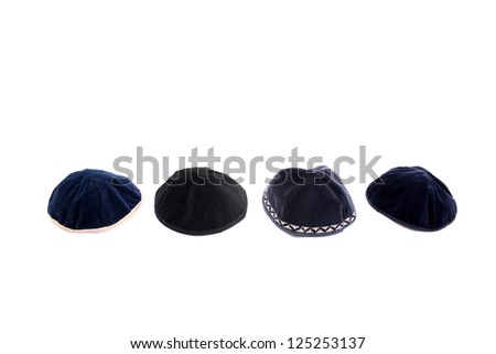 A kippah is a small cap (head covering), is a thin, slightly-rounded skullcap traditionally worn by observant Jewish men. Royalty-Free Stock Photo #125253137