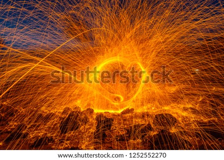 heart image from steel wool on the rock at sunrise