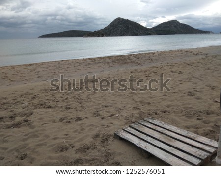 Objects and standing waters on the beach